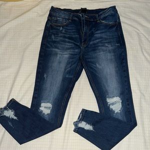 Dark blue distressed jeans